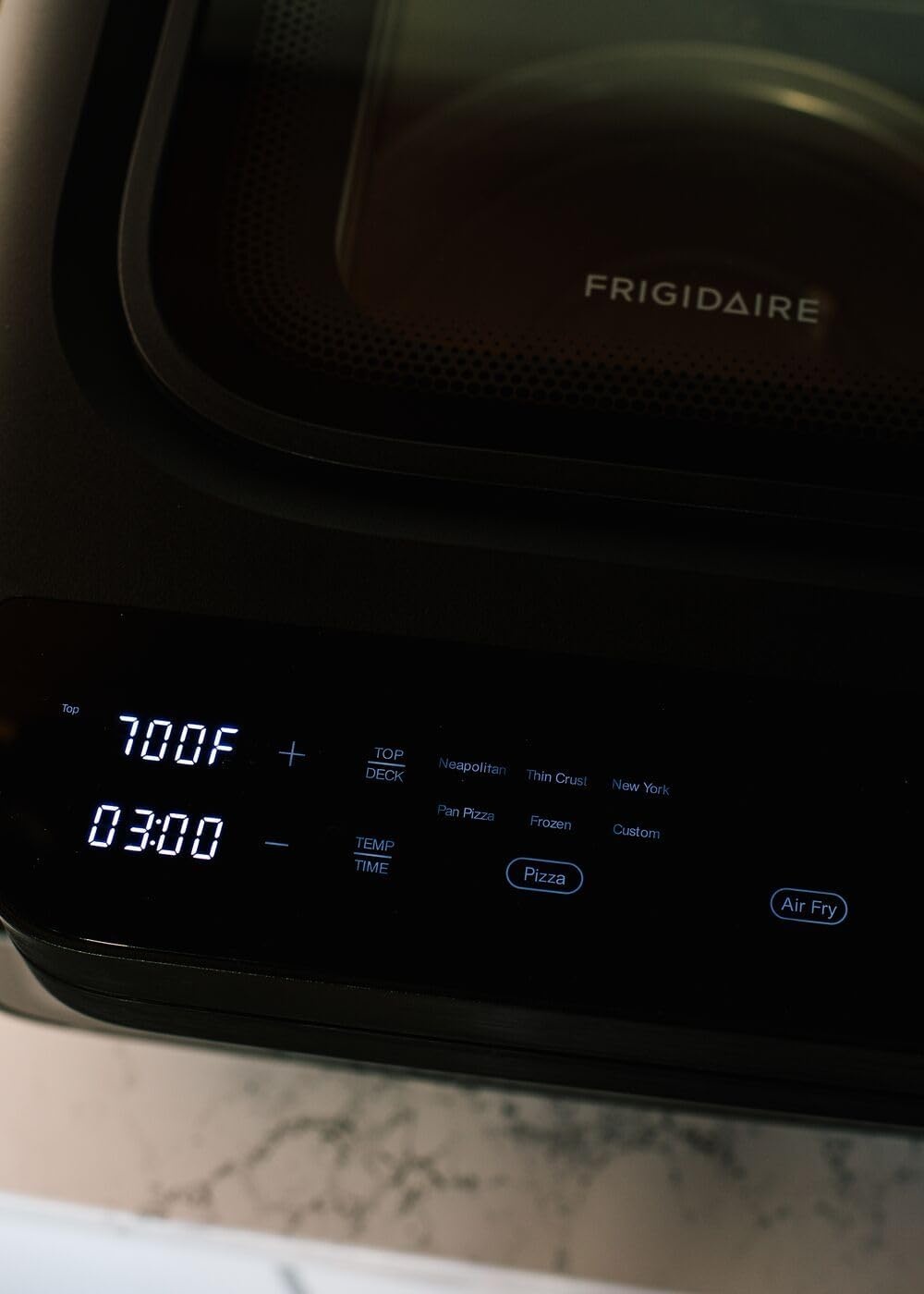 image:imageFrigidaire Electric Indoor Pizza Oven Reach Temperatures of 700F Stone Bake 12 Pizzas in Minutes Portable Countertop Oven with Air Fry and Bake Peel Included Model FRPO100BWith Pizza Peel Pizza Cutter