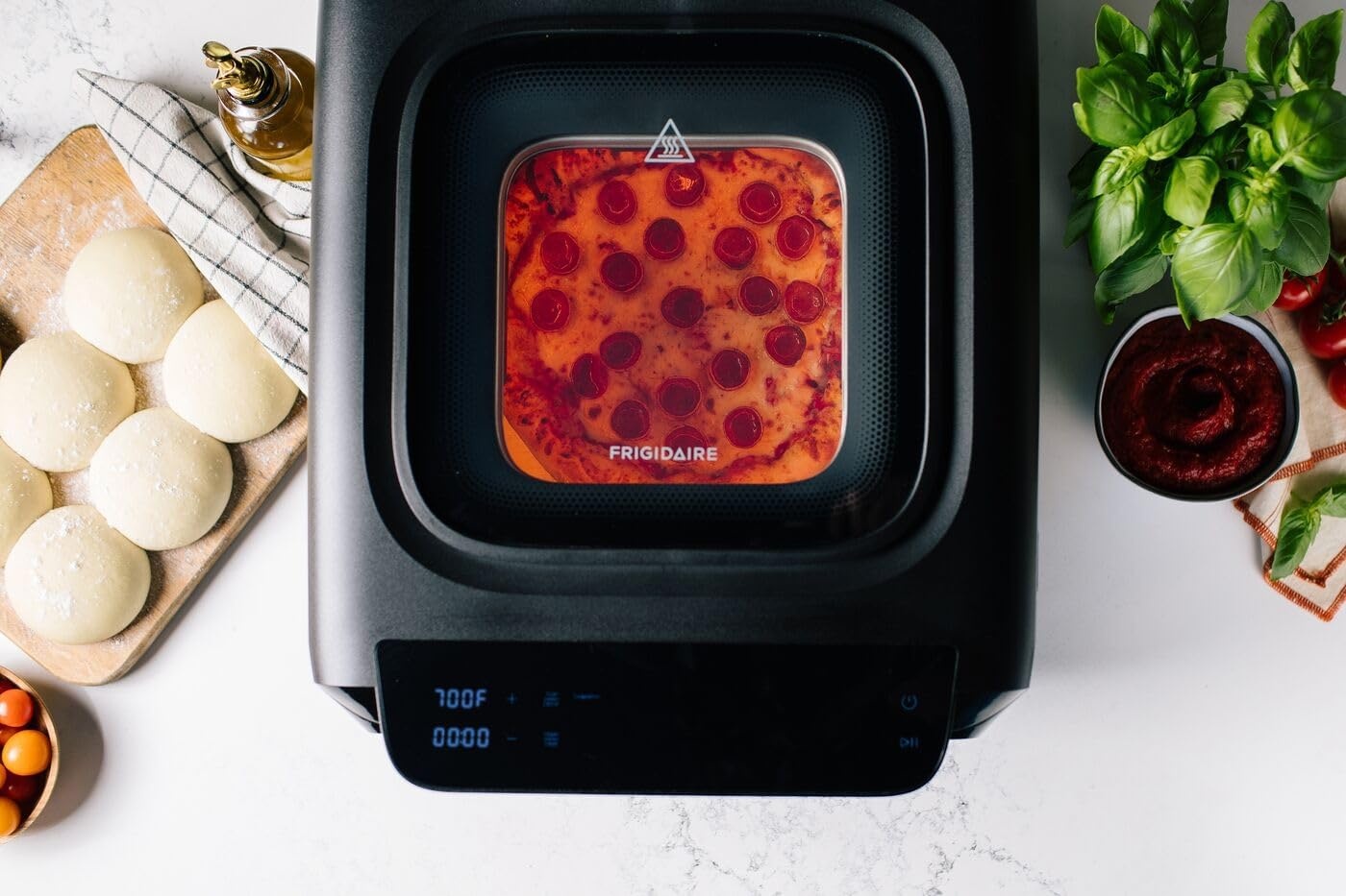 image:imageFrigidaire Electric Indoor Pizza Oven Reach Temperatures of 700F Stone Bake 12 Pizzas in Minutes Portable Countertop Oven with Air Fry and Bake Peel Included Model FRPO100BWith Pizza Peel Pizza Cutter