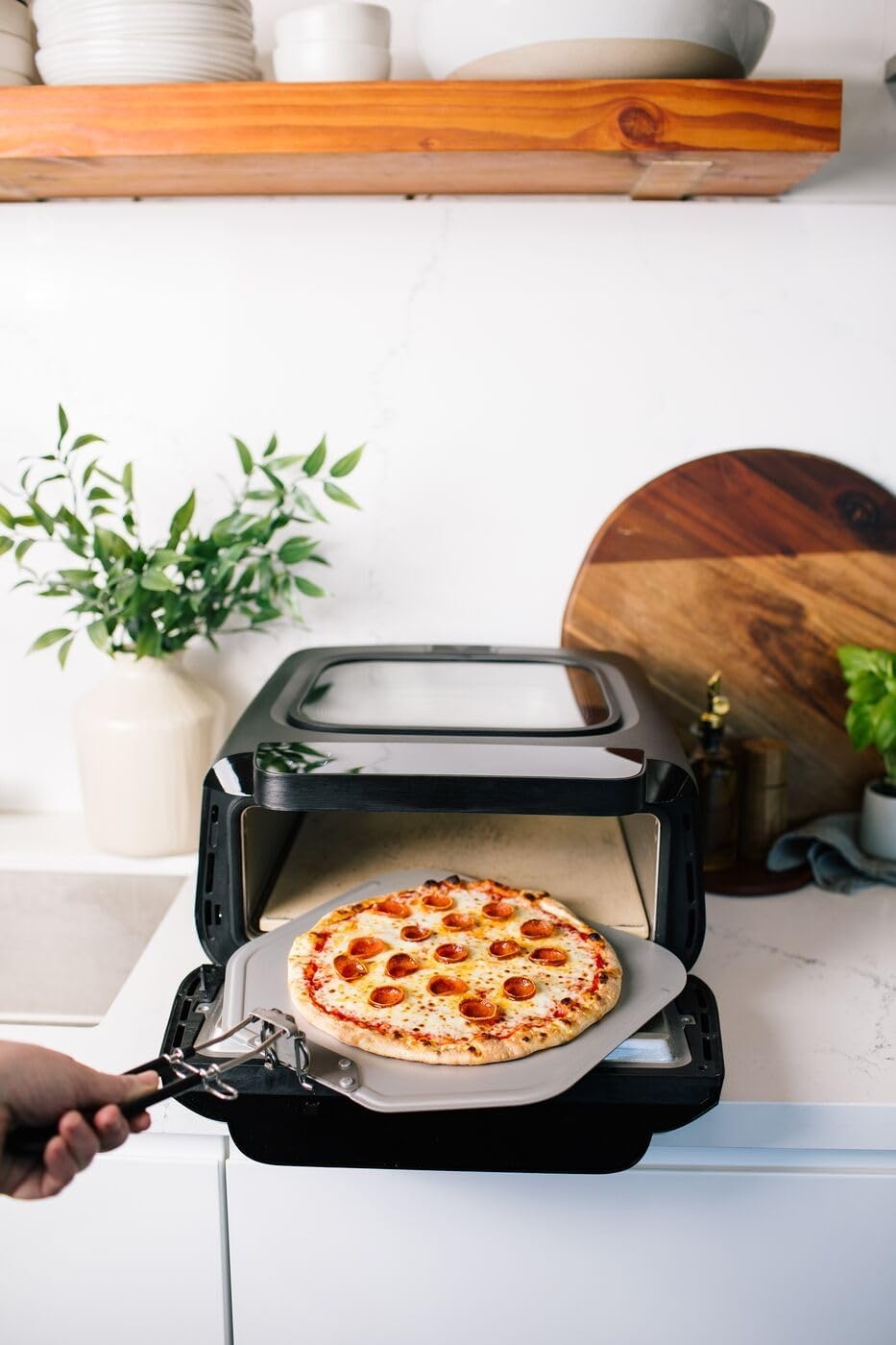 image:imageFrigidaire Electric Indoor Pizza Oven Reach Temperatures of 700F Stone Bake 12 Pizzas in Minutes Portable Countertop Oven with Air Fry and Bake Peel Included Model FRPO100BWith Pizza Peel Pizza Cutter