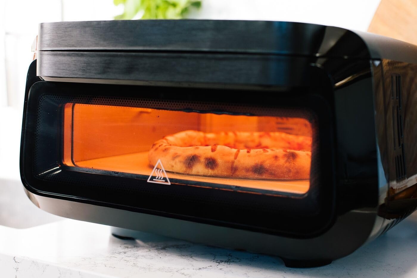 image:imageFrigidaire Electric Indoor Pizza Oven Reach Temperatures of 700F Stone Bake 12 Pizzas in Minutes Portable Countertop Oven with Air Fry and Bake Peel Included Model FRPO100BWith Pizza Peel Pizza Cutter